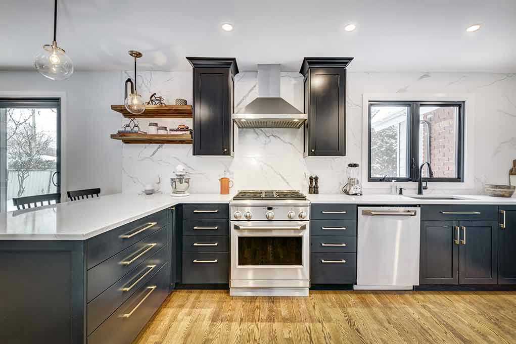 Modern kitchen with black cabinets and stainless appliances
