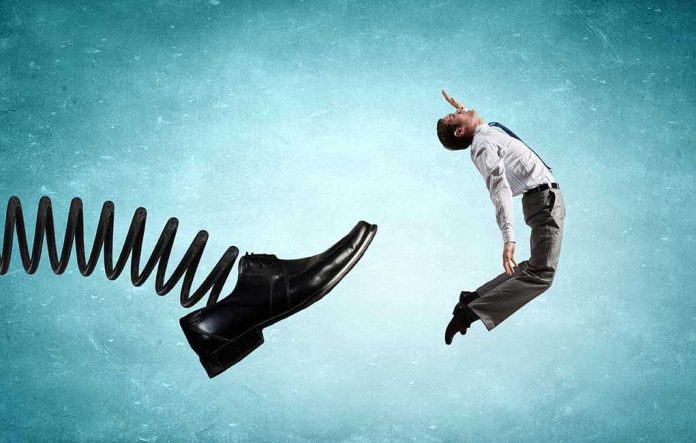 353283212 Man gets kicked by oversized shoe on spring