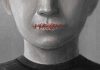 Face with mouth sewn shut in red thread