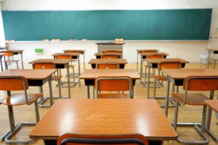 Empty classroom with desks and a chalkboard