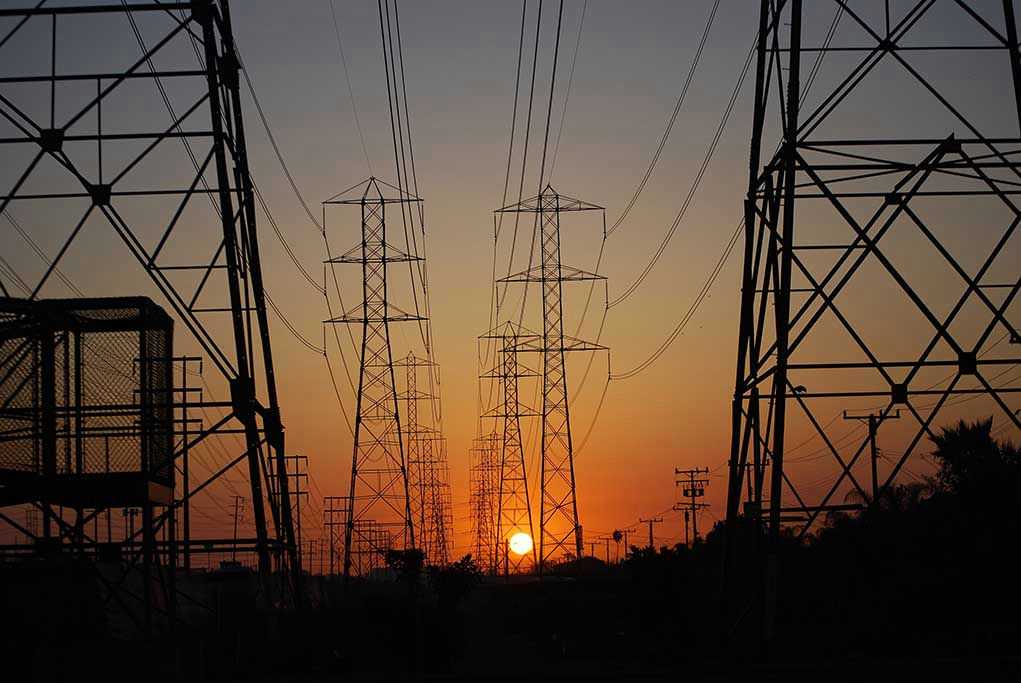 Transmission towers at sunset.