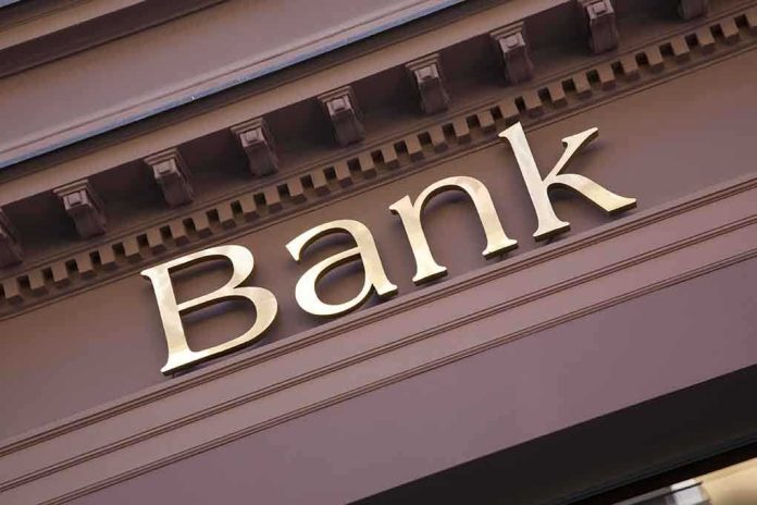 Close up of a bank sign with gold lettering