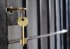 Key in lock of prison cell door
