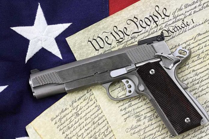 129482747 Gun on U.S. Constitution and flag