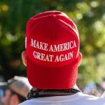 Person wearing a red Make America Great Again hat