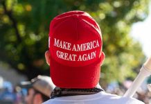 Person wearing a red Make America Great Again hat