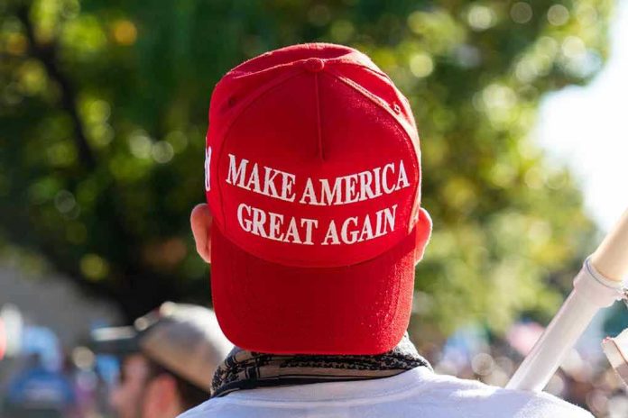1850438311 Person wearing a red Make America Great Again hat