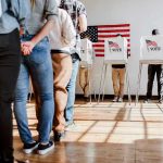 People in line at voting booths