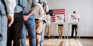 People in line at voting booths