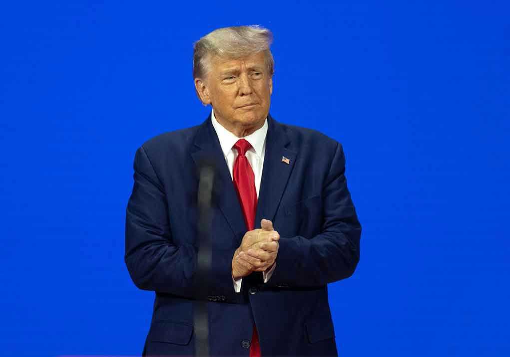 Man in a suit with a blue background