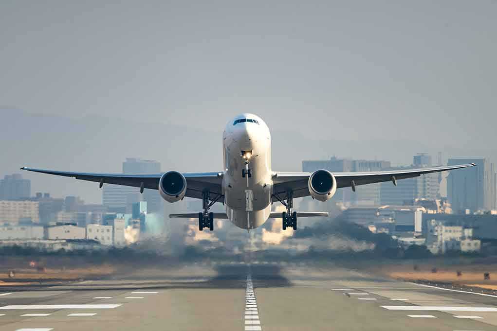 An airplane taking off from an airport runway