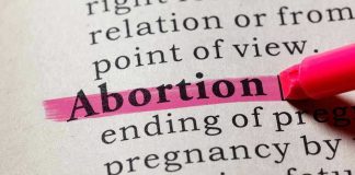 Abortion highlighted in a dictionary with a pink marker
