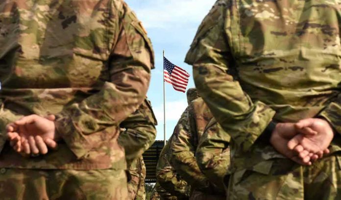 1507031819 Soldiers stand in formation with American flag in background