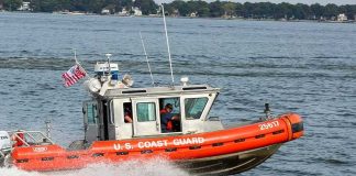Coast Guard boat speeding on the water