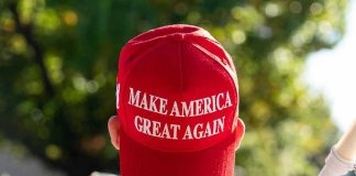Person wearing a red Make America Great Again hat