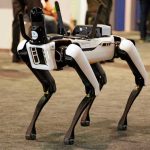 China’s Robo-Dog Raises US Security Alarms Robotic dog standing on indoor carpeted floor