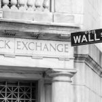Stock Exchange building and Wall Street sign