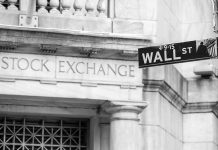 Stock Exchange building and Wall Street sign