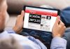 Democratic Mom’s Anti-Parent Voting Record LEAKED Person reading tablet with headline Scandal Unfolds