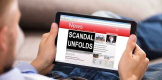 Person reading tablet with headline Scandal Unfolds