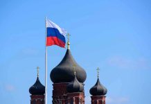 Russian flag next to church domes