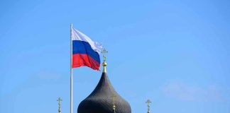 Russian flag next to church domes