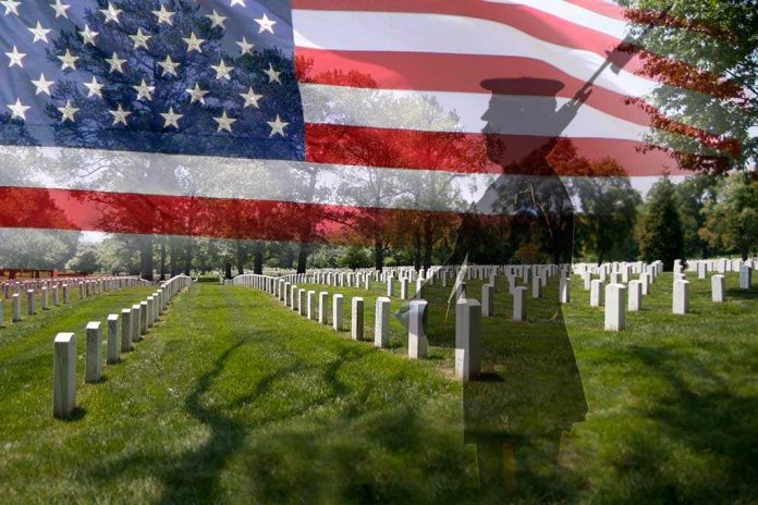 shutterstock_109165295.jpg A military cemetery with white gravestones and an American flag overlay featuring a soldier silhouette