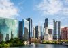 City’s’s WAR Cries Stir National Fury Chicago skyline featuring modern skyscrapers along a river