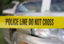 Deadly First Date—Woman Dodges Blame Yellow police tape reading POLICE LINE DO NOT CROSS in front of a vehicle