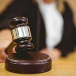 Judge striking gavel in a courtroom