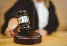 Teacher Wins MASSIVE Verdict After Student Attack Judge striking gavel in a courtroom