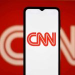 Conservative Warrior TRIGGERS CNN Panic Mode CNN logo on a phone screen.