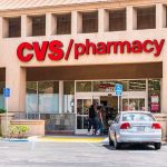 Exterior view of a CVS pharmacy with customers entering