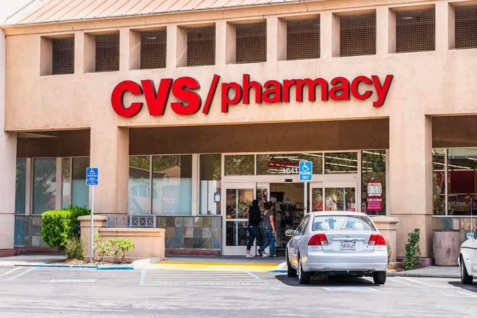 shutterstock_1471184933.jpg Exterior view of a CVS pharmacy with customers entering