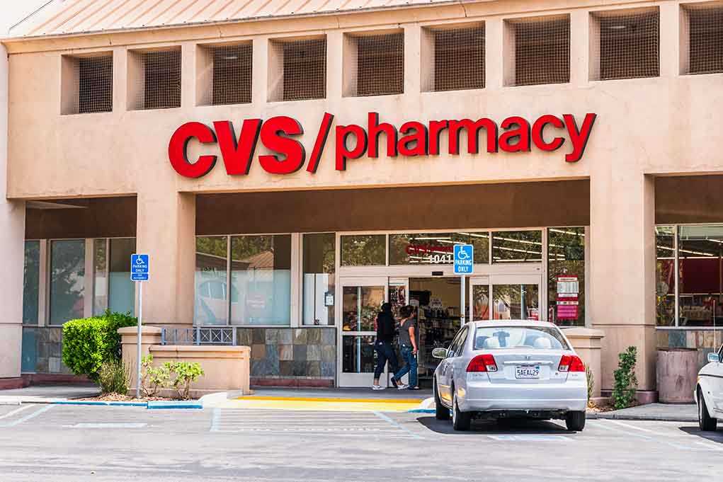 Exterior view of a CVS pharmacy with customers entering