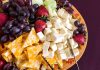 Massive Cheese Recall: Hidden Metal Threat A colorful cheese and fruit platter featuring various cheeses and fresh fruits