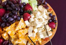 Massive Cheese Recall: Hidden Metal Threat A colorful cheese and fruit platter featuring various cheeses and fresh fruits