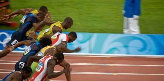 Runners sprinting at the start of a race during the Olympics