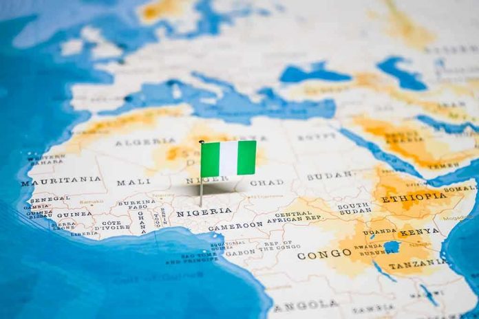 1326882539 Flag pin marking Nigeria on Africa map.