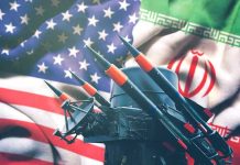 Iran Chaos: U.S. Intervention Imminent? Iran and USA flags with missile launcher.