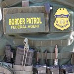 ICE Photo Rage Turns UGLY Fast Border Patrol vest with gear and communication equipment.