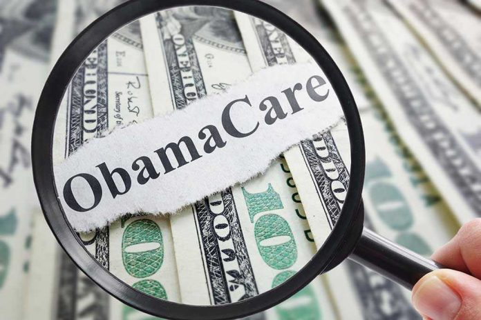 468939914 Magnifying glass over Obamacare text and money