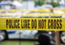 Violent Home Invasion Targets Child Yellow police line tape with Do Not Cross.