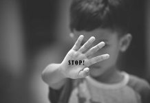 Child Predator Gets SLAP On Wrist! Child holding up hand with STOP! written on palm.
