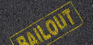 Yellow BAILOUT text marked on a black asphalt surface