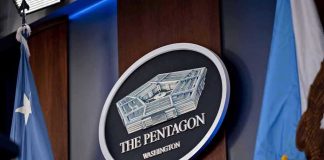 Pentagon Photo Blunder Sparks Outrage The Pentagon emblem between two flags.