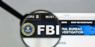 FBI Missed Trump Assassination Threats FBI website shown through magnifying glass.
