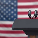A Clear Red Line: Military Action on the Table Podium with microphones in front of American flag.