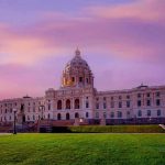 Alabama Map Chaos: New Rules Unleash Legal Showdown Historic building with dome under a pinkish-purple sky.