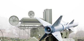 A missile system with a radar unit in a military setting